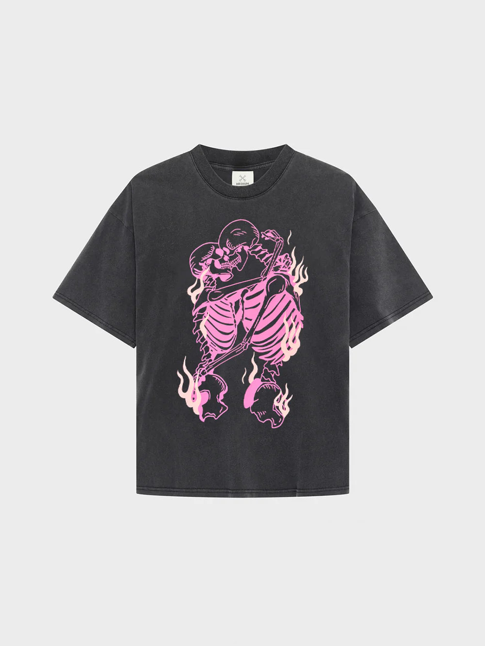 Black t-shirt with pink skeleton design on a light gray background