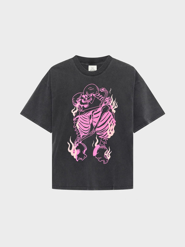 Black t-shirt with pink skeleton design on a light gray background