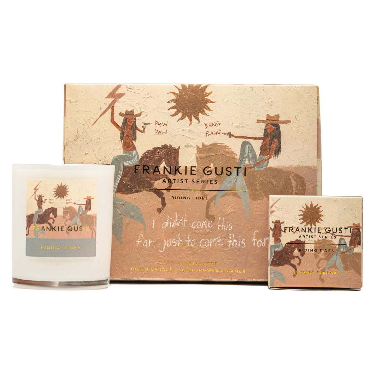 candle and shower steamer set , artwork on box and items is by artist Tahnee Kelland and is beige with a sun and cowboy mermaids on horses shooting guns, text says I didn't come this far just to come this far