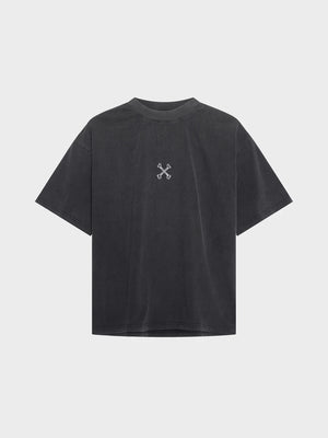 Black t-shirt with a small white logo on the back against a light gray background