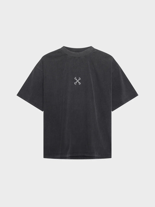 Black t-shirt with a small white logo on the back against a light gray background