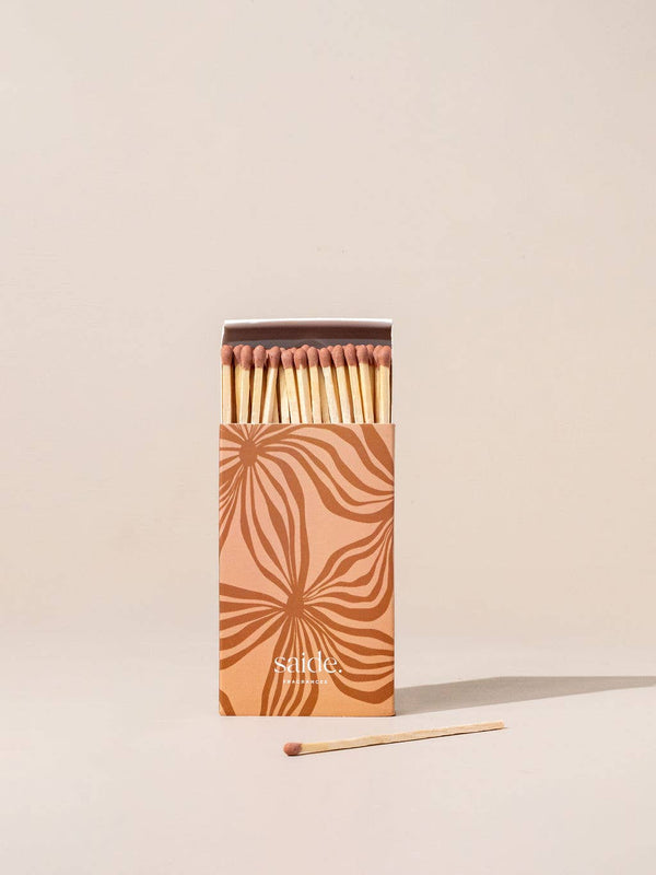 Matches in a decorative box on a beige background