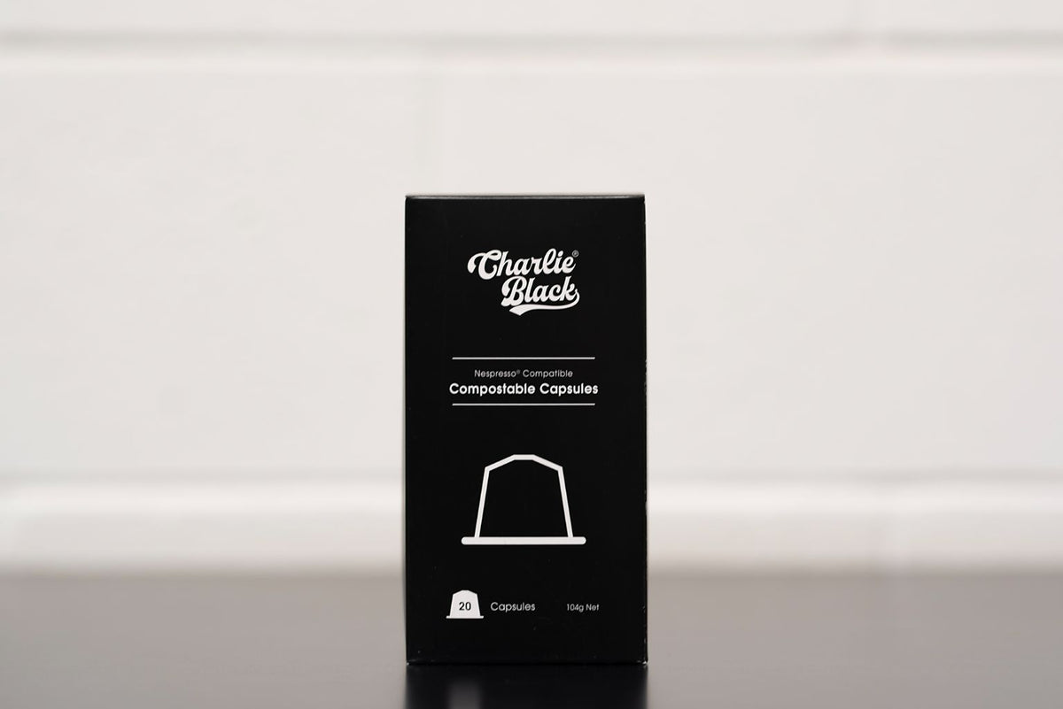 Black box of Charlie Black compostable capsules on a white background
