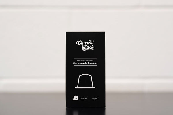 Black box of Charlie Black compostable capsules on a white background