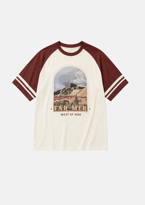 A short-sleeve raglan t-shirt with cream-colored body and dark red sleeves, featuring a vintage-style 'Farmer West of Here' graphic on the chest and white stripes on the sleeves.